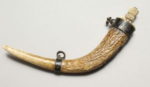 A VICTORIAN ANTLER POWDER FLASK with metal band dated 1862, the top with an acorn finial