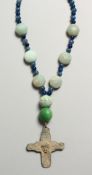 A SMALL ROMAN IRON CROSS AND BEADS