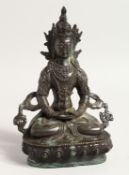AN EARLY BRONZE GOD sitting cross legged 8ins high.