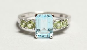 A SILVER AND AQUAMARINE FIVE STONE RING