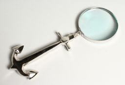A NOVELTY MAGNIFYING GLASS the handle as an anchor.