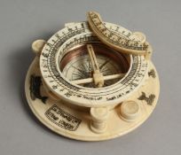 AN ETCHED CIRCULAR BONE COMPASS 4ins diameter.