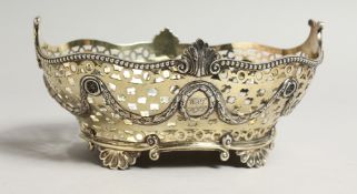 A PIERCED OVAL SILVER BASKET hung with garlands. London 1898.