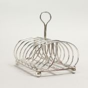 A MATTHEW BOULTON OLD SHEFFIELD PLATE, SIX DIVISION TOAST RACK, of scrolling design, impressed marks