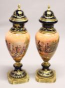 A LARGE PAIR OF PORCELAIN AND ORMOLU URNS ON STANDS, decorated with Napoleonic scenes 3ft 4ins