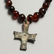 A SMALL ROMAN IRON CROSS AND BEADS
