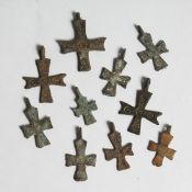 TEN VARIOUS SMALL IRON CROSSES