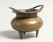 A CHINESE BRONZE TWO HANDLED CENSER with 16 marks. 3.5INS DIAMETER