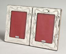 A PAIR OF SILVER ART NOUVEAU DESIGN PHOTOGRAPH FRAMES 7.5 x 5ins