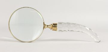 A MAGNIFYING GLASS.