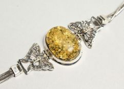A SILVER AND AMBER BRACELET