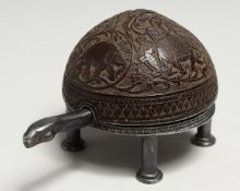 A SUPERB SILVER AND ENGRAVED COCONUT TORTOISE SHAPED CLOCK, carved with elephants, with Verge