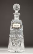 A CUT GLASS DECANTER of tapering form with silver whisky decanter label. 12ins high.
