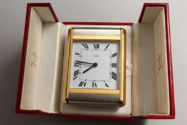 A VERY GOOD CARTIER PARIS TRAVELLING CLOCK in a red Cartier case, No. 750503920.
