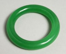 A CHINESE GREEN JADE BANGLE