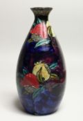 A RUBENS WARE BLUE GROUND VASE painted with fruit by F.X. ABRAHAM. 9.5ins high.