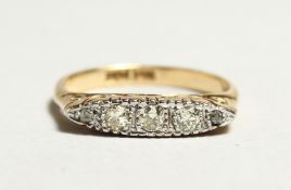 AN 18CT GOLD AND DIAMOND RING