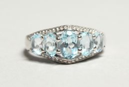 A SILVER AND AQUAMARINE FIVE STONE RING