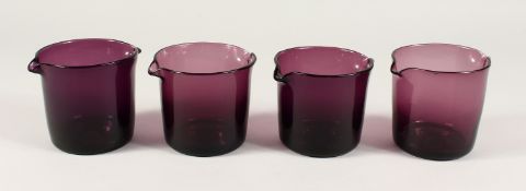 A MATCHED SET OF FOUR EARLY 19TH CENTURY AMETHYST COLOURED GLASS RINSERS. 3.75ins & 4ins high.