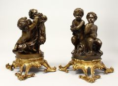 A VERY GOOD PAIR OF BRONZE FIGURES OF PUTTI AND FAUNS on ormolu bases 9.5ins high.
