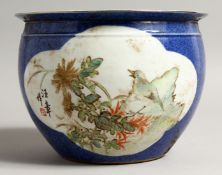 A CHINESE BLUE GROUND JARDINIERE with panels of birds. 7.5ins diameter.