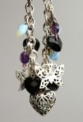 A SILVER CHARM BRACELET SET WITH OPALS AND GARNETS