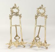 A PAIR OF LARGE BRASS EASELS.