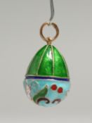 A SMALL RUSSIAN SILVER AND ENAMEL EGG PENDANT.