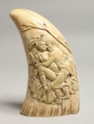 A LARGE EROTIC CARVED WHALES TOOTH 6.5ins long.