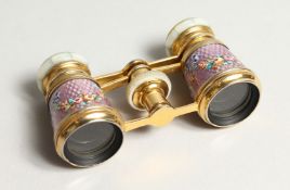 A GOOD SMALL PAIR OF ORMOLU AND LILAC ENAMEL OPERA GLASSES, painted with flowers.