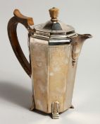 AN ART DECO DESIGN SILVER COFFEE POT with wooden handle and finial. Birmingham, 1937, gross weight