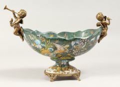 AN OVAL PORCELAIN BOWL with cherub handles 11ins long