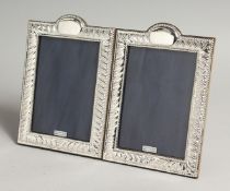 A PAIR OF SILVER WRYTHEN FLUTE DESIGN PHOTOGRAPH FRAMES 7.5ins x 5ins