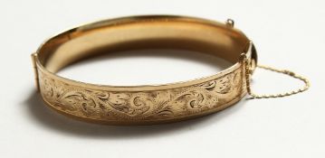 A 9CT GOLD AND EMERALD BRACELET. J.E.E.S. 29gms.