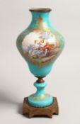 A GOOD 19TH CENTURY SEVRES BLUE GROUND LAMP BASE painted with a panel of young lovers, with ormolu