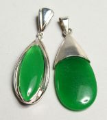 TWO SILVER AND JADE PENDANTS