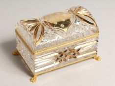 A CUT GLASS AND GILDED DOMED TOP JEWEL CASKET on claw feet. 7ins high.