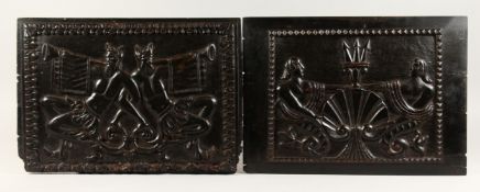 AN EARLY PAIR OF CARVED METAMORPHIC BLACK WOODEN PANELS. The Devil 13ins x 18ins.