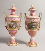 A VERY GOOD PAIR OF 19TH CENTURY SEVRES URN SHAPED TWO HANDLED VASES AND COVERS with rose
