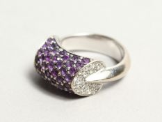 AN 18CT WHITE GOLD AMETHYST AND DIAMOND RING.