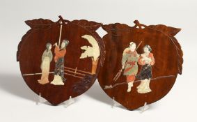 A PAIR OF HARDSTONE CHINESE PEACH SHAPED PLAQUES inset with hardstones. 10ins x 10ins