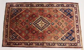 A PERSIAN JOSHAQAN RUG, pink ground with all over floral decoration. 7ft 2ins x 4ft 6ins.