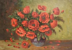 20th Century, a still life of poppies in a vase, oil on board, indistinctly signed, 19.5