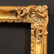 A 20th Century carved frame, rebate size - 14