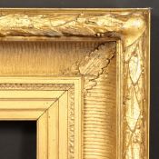 A 19th Century Continental gilt composition frame with acanthus pattern to the top ornament,