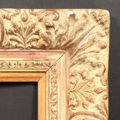 An Early 20th Century gilt composition frame with an oak slip, rebate size - 23.5