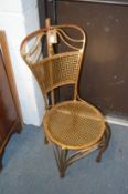 A gilt metal bistro style occasional chair.