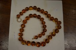 An amber bead necklace.