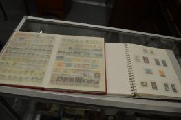 Stamps, two albums containing numerous New Zealand stamps.