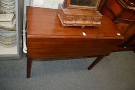 A small mahogany drop-leaf table with a drawer to each end.